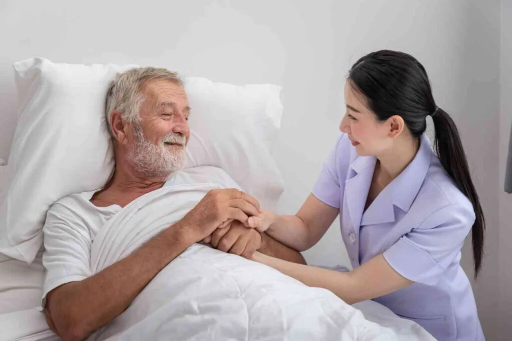 nurse taking care of old patient